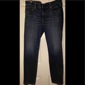 American Eagle Outfitters skinny jeans with distressed wear detail.